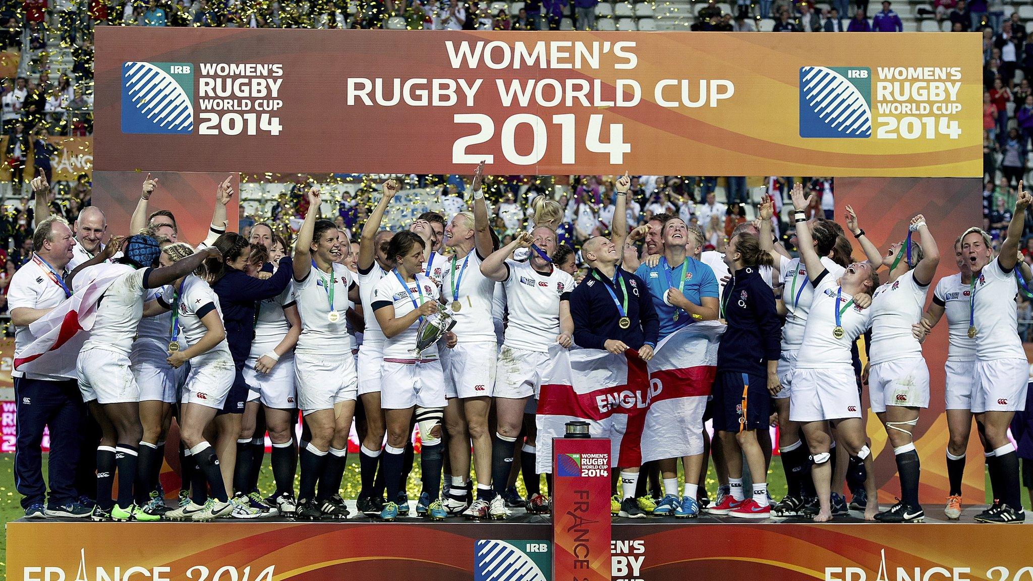 England's players celebrate with the trophy after winning the IRB Women's Rugby World Cup final match between England and Canada at the Jean Bouin Stadium in Paris on August 17, 2014