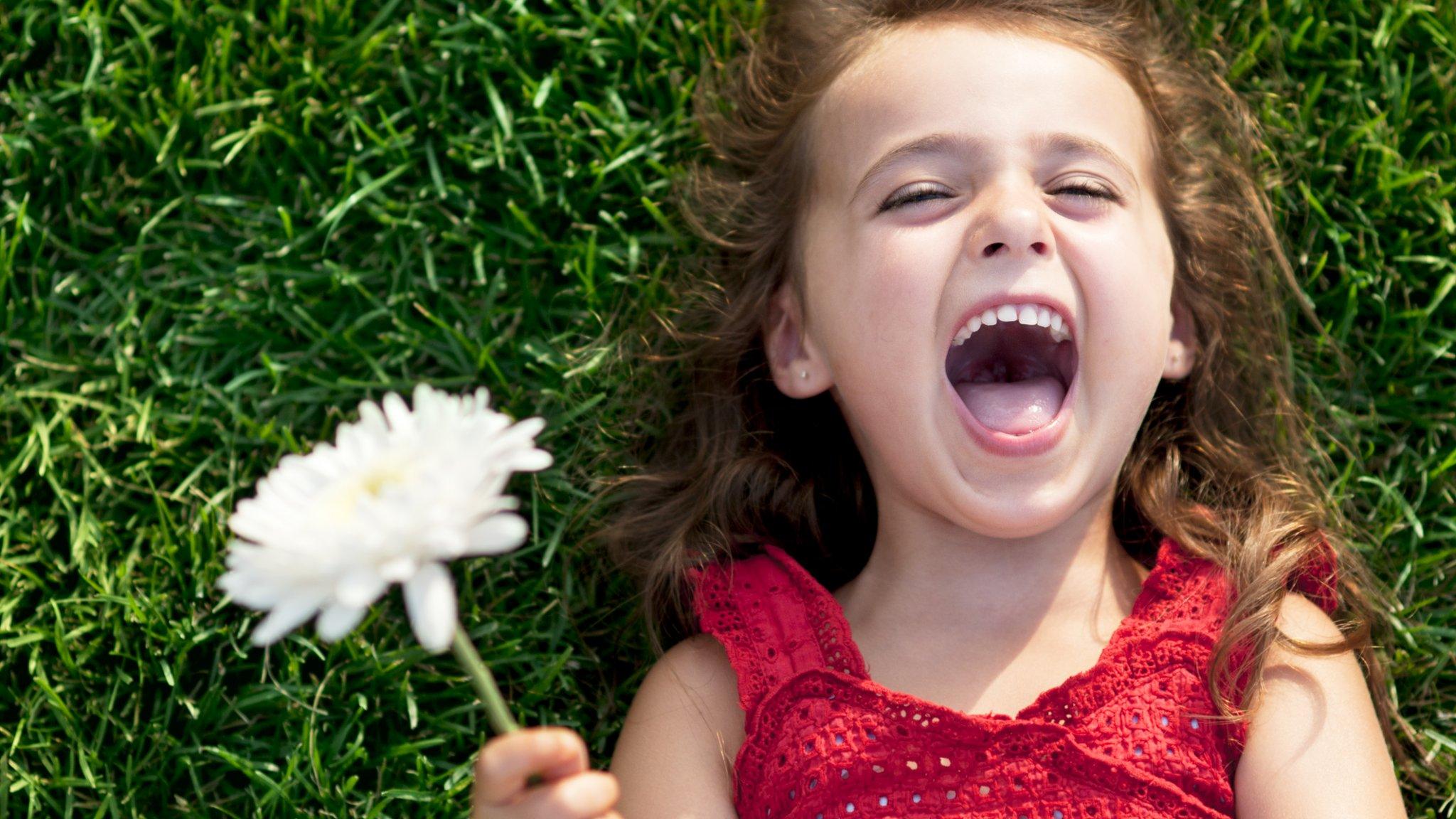 Happy girl with flower