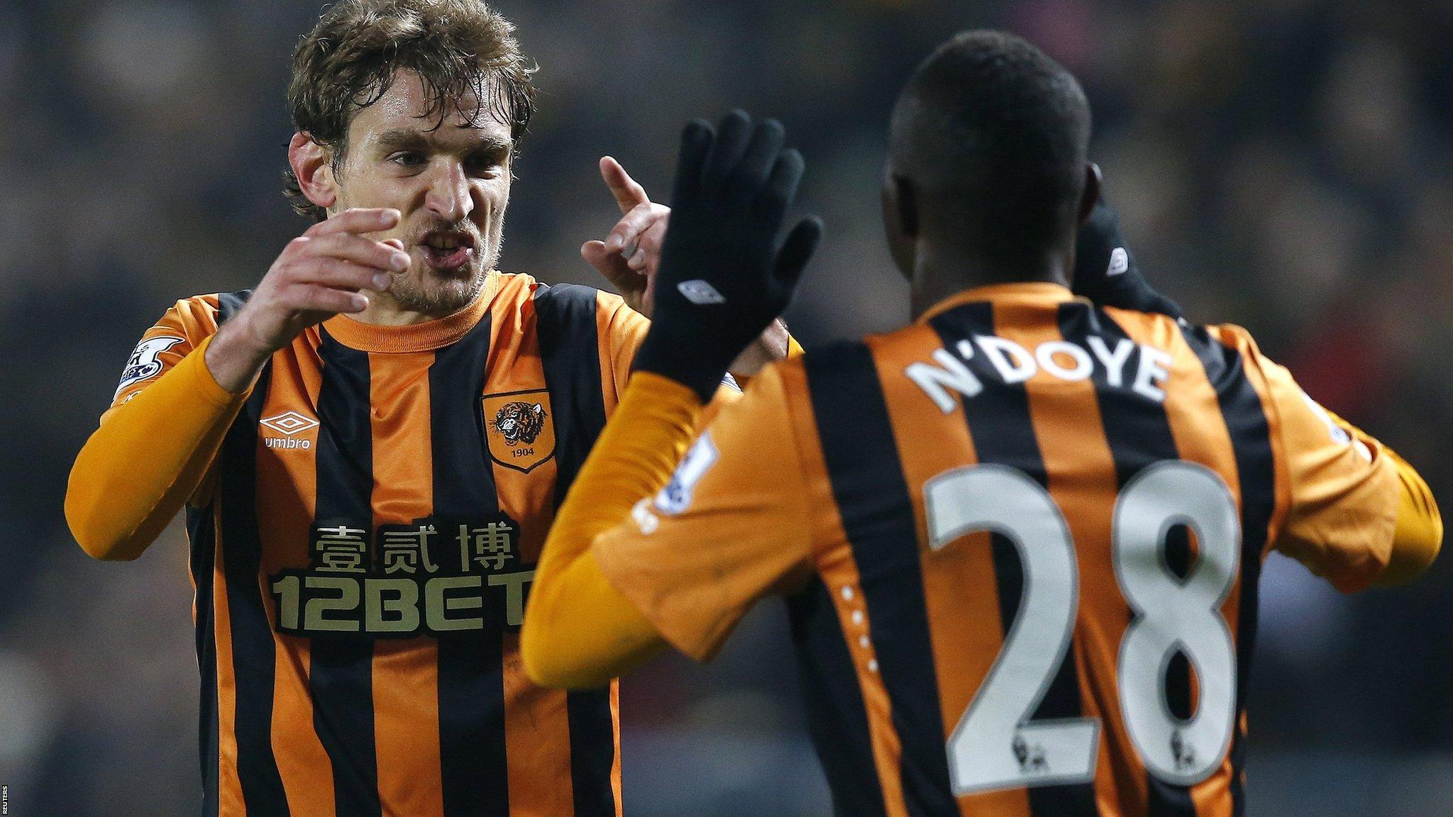 Nikica Jelavic and Dame N'Doye celebrate Hull's first goal