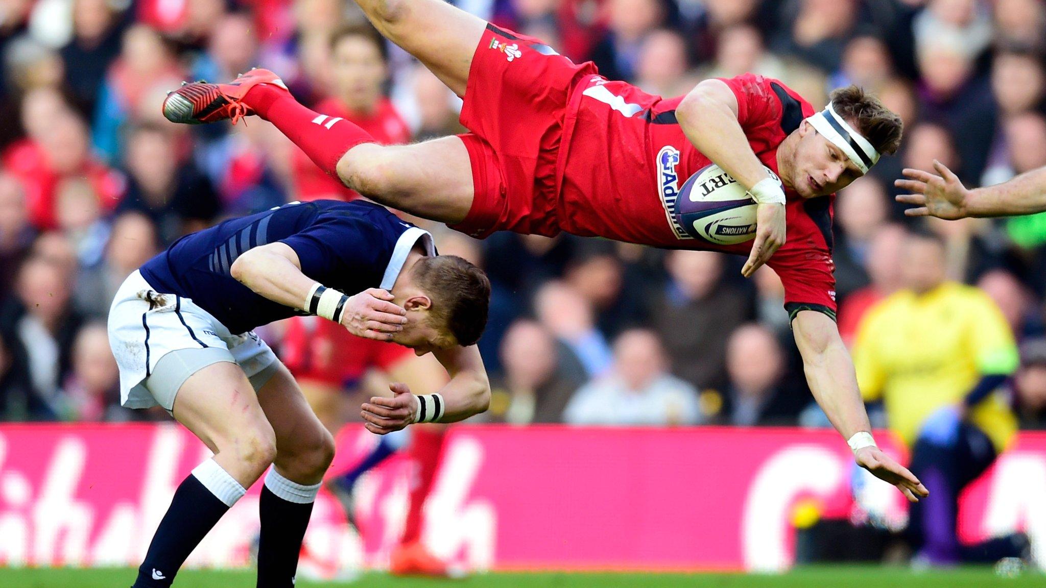 Dan Biggar is upended in a collision with opposite number Finn Russell