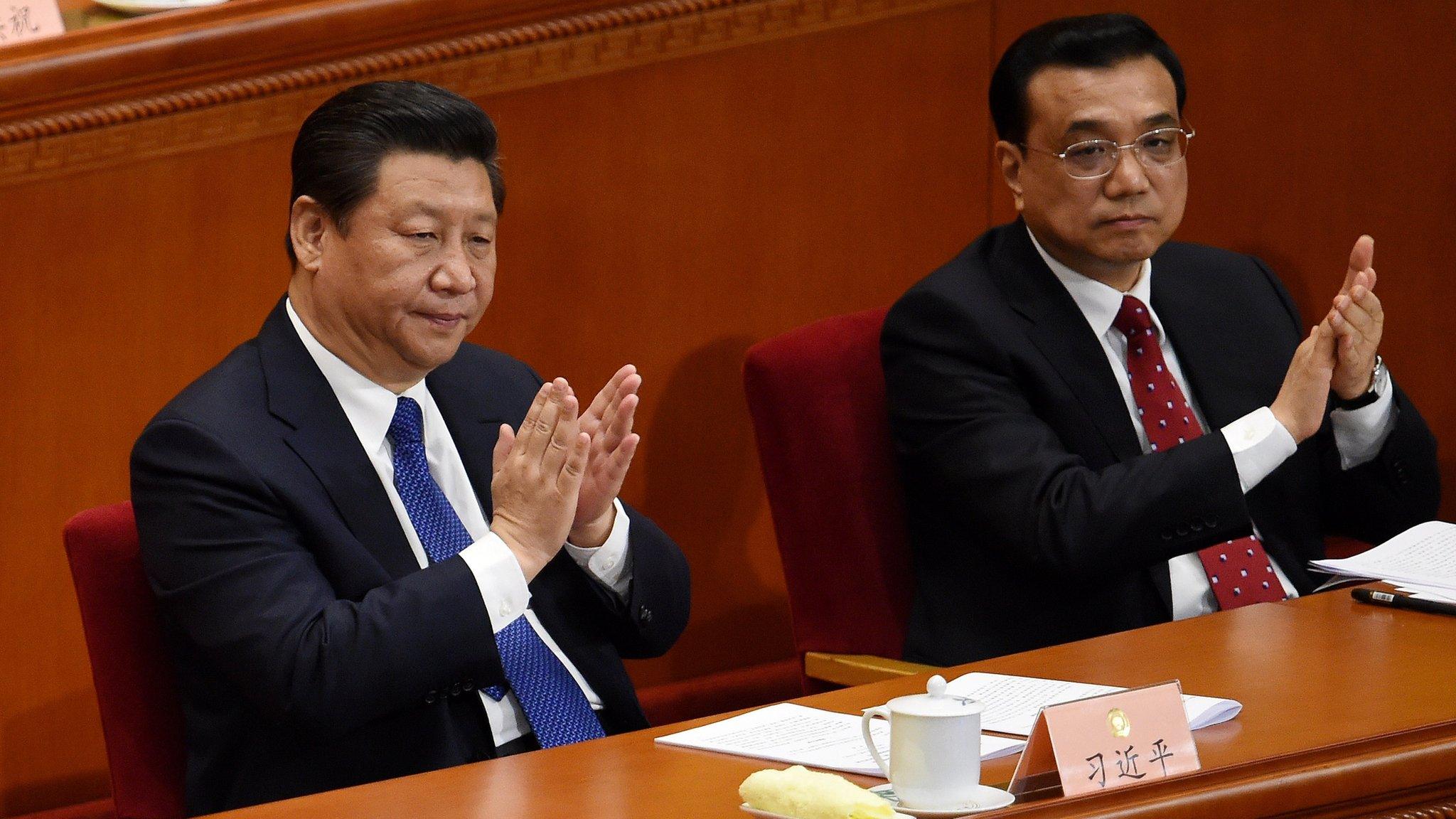 Chinese president Xi Jinping (L) and premier Li Keqiang