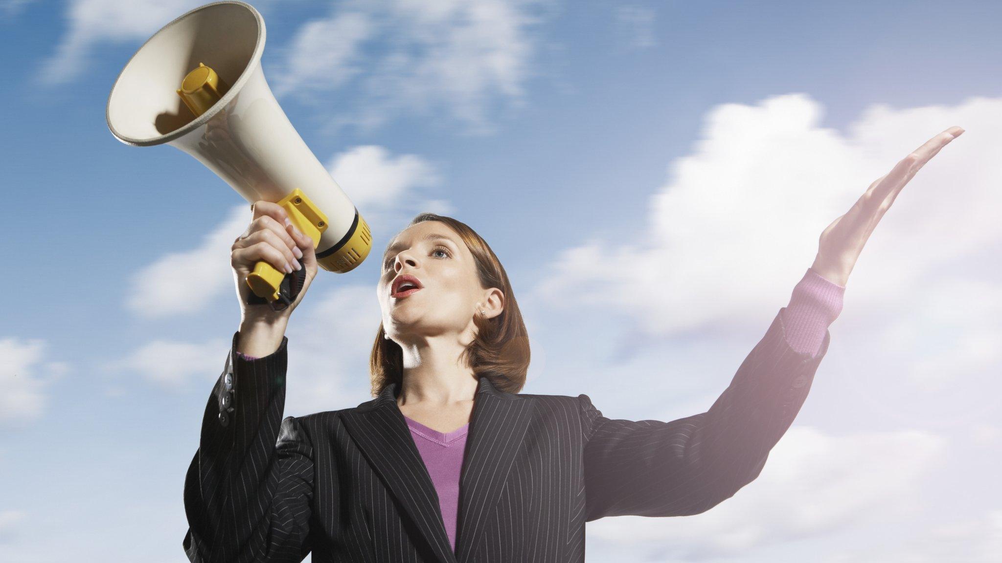 Woman with loudhaler