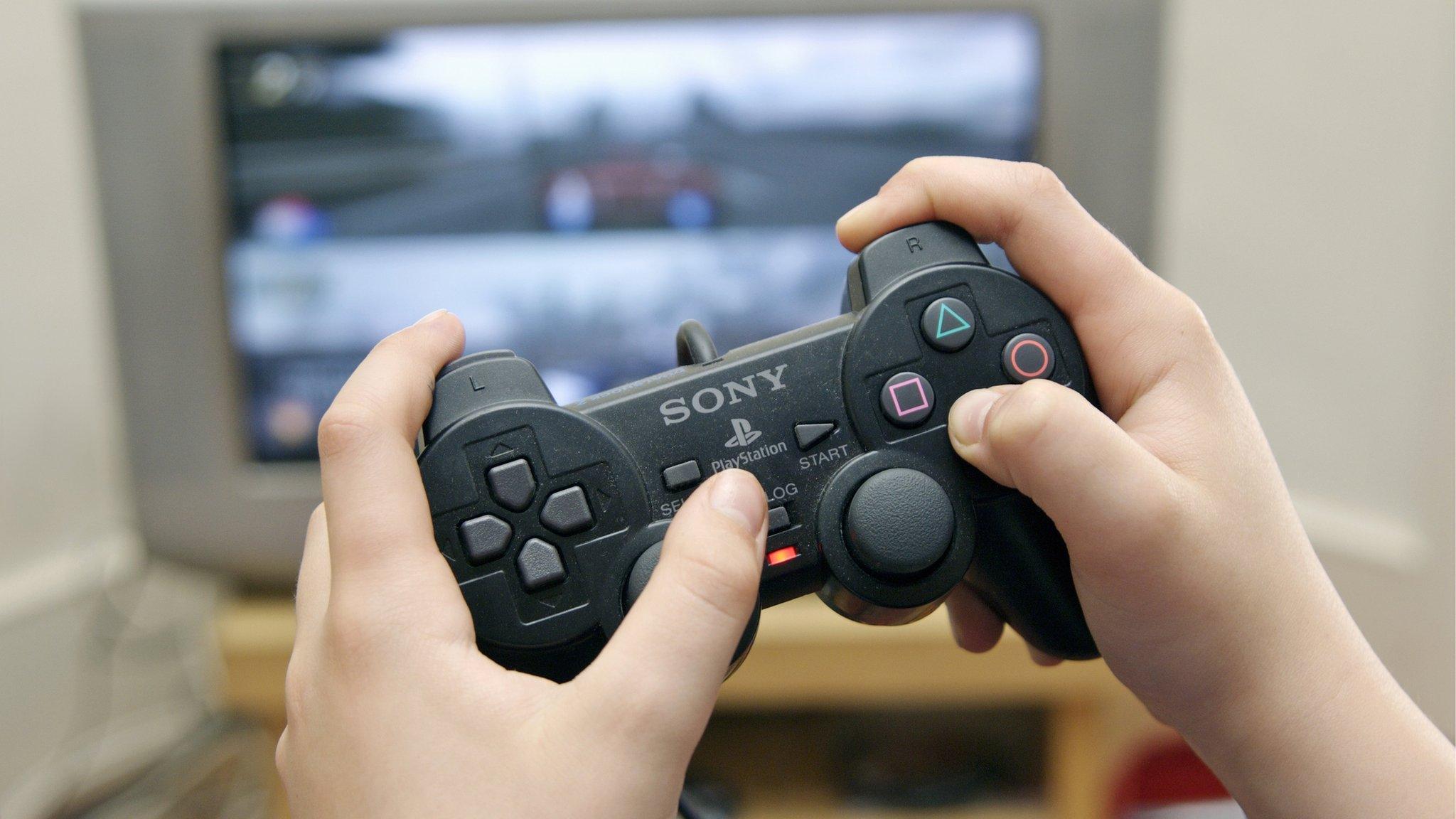 A child playing a game using a controller.