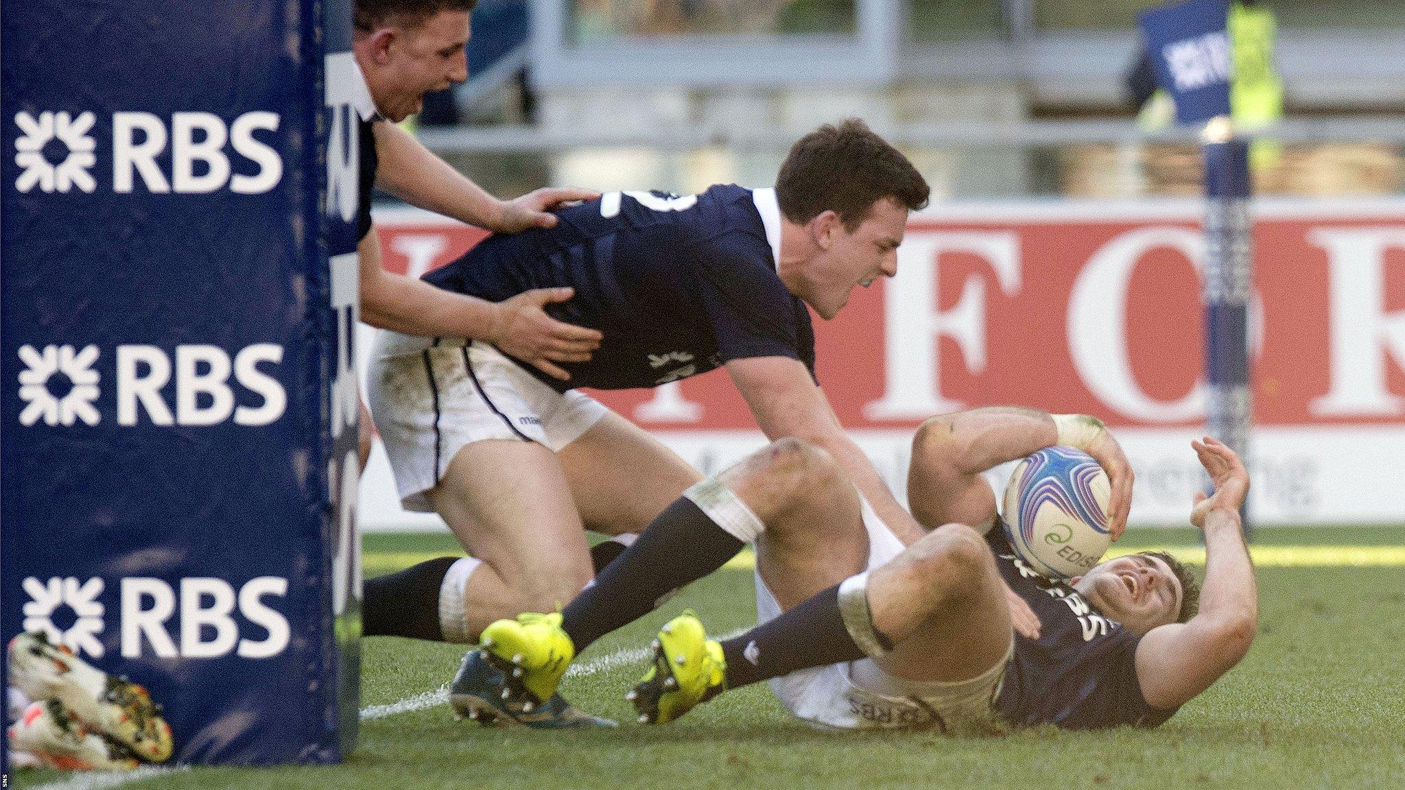 Scott celebrates with Dunbar after the latter's try against Italy last year