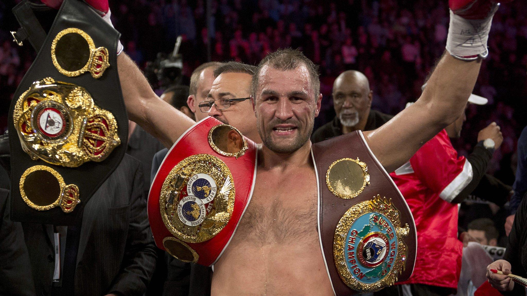 Sergey Kovalev displays his trio of titles