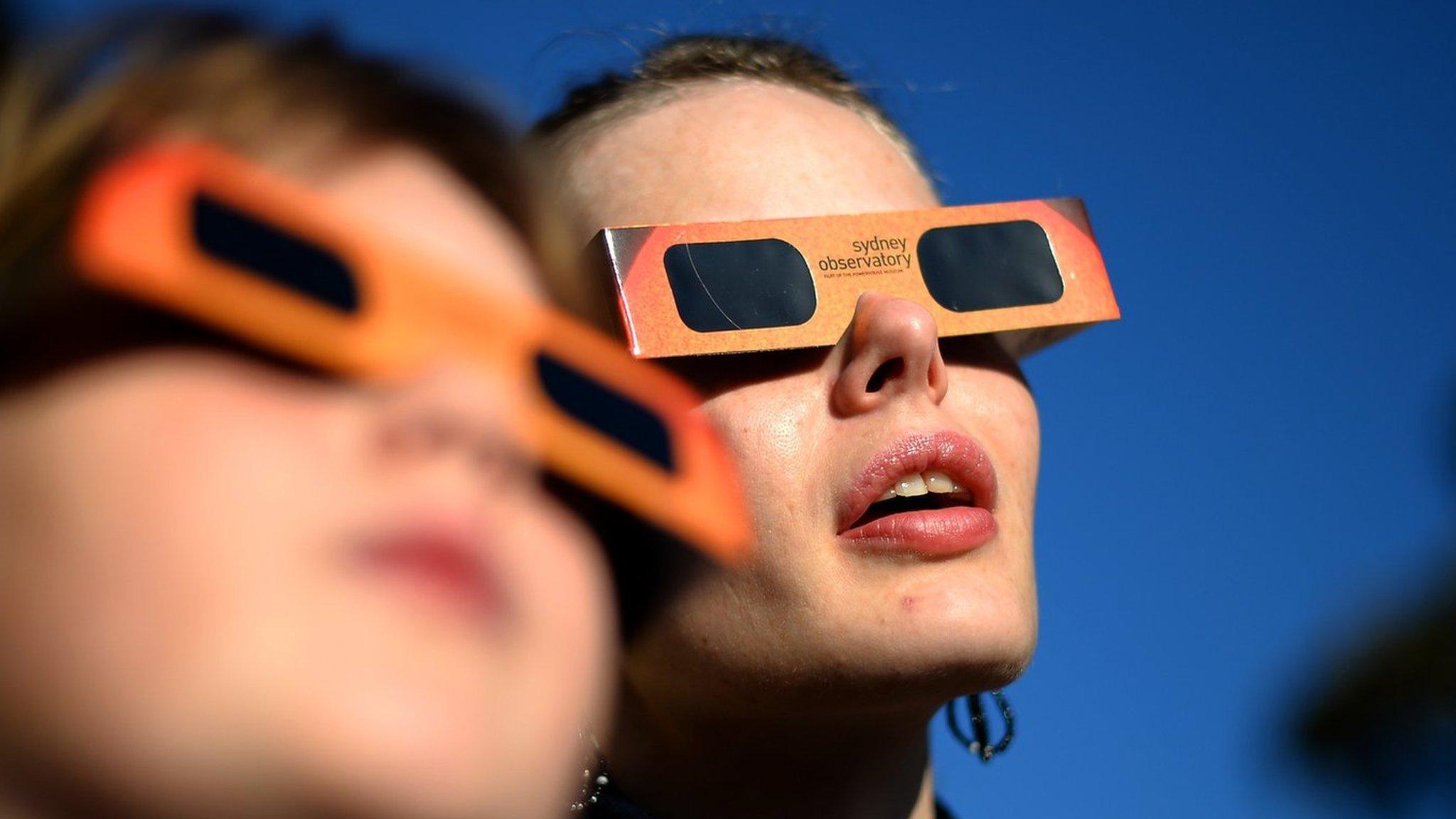 Children watching an eclipse