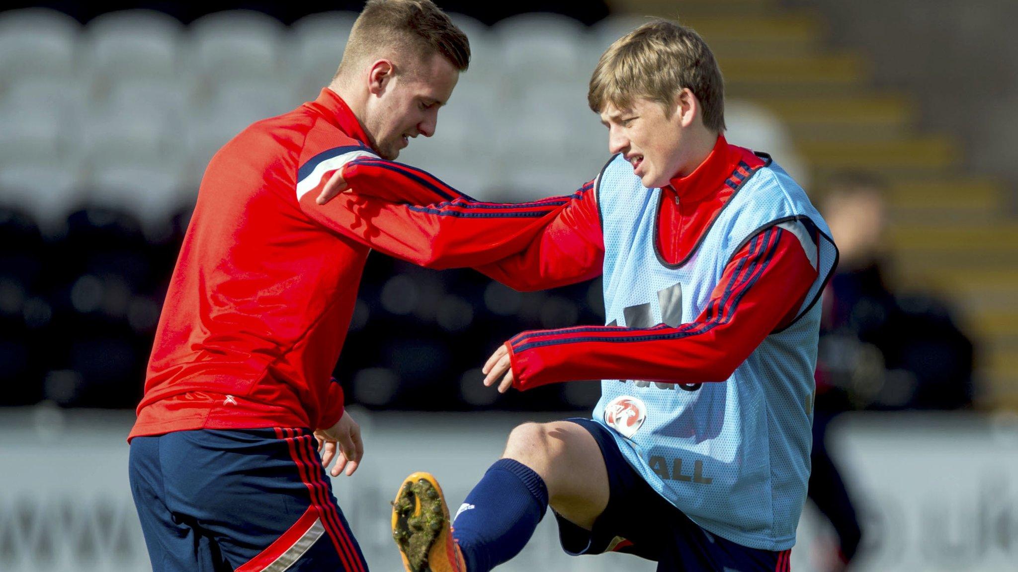 Billy King warms up with Ryan Gauld