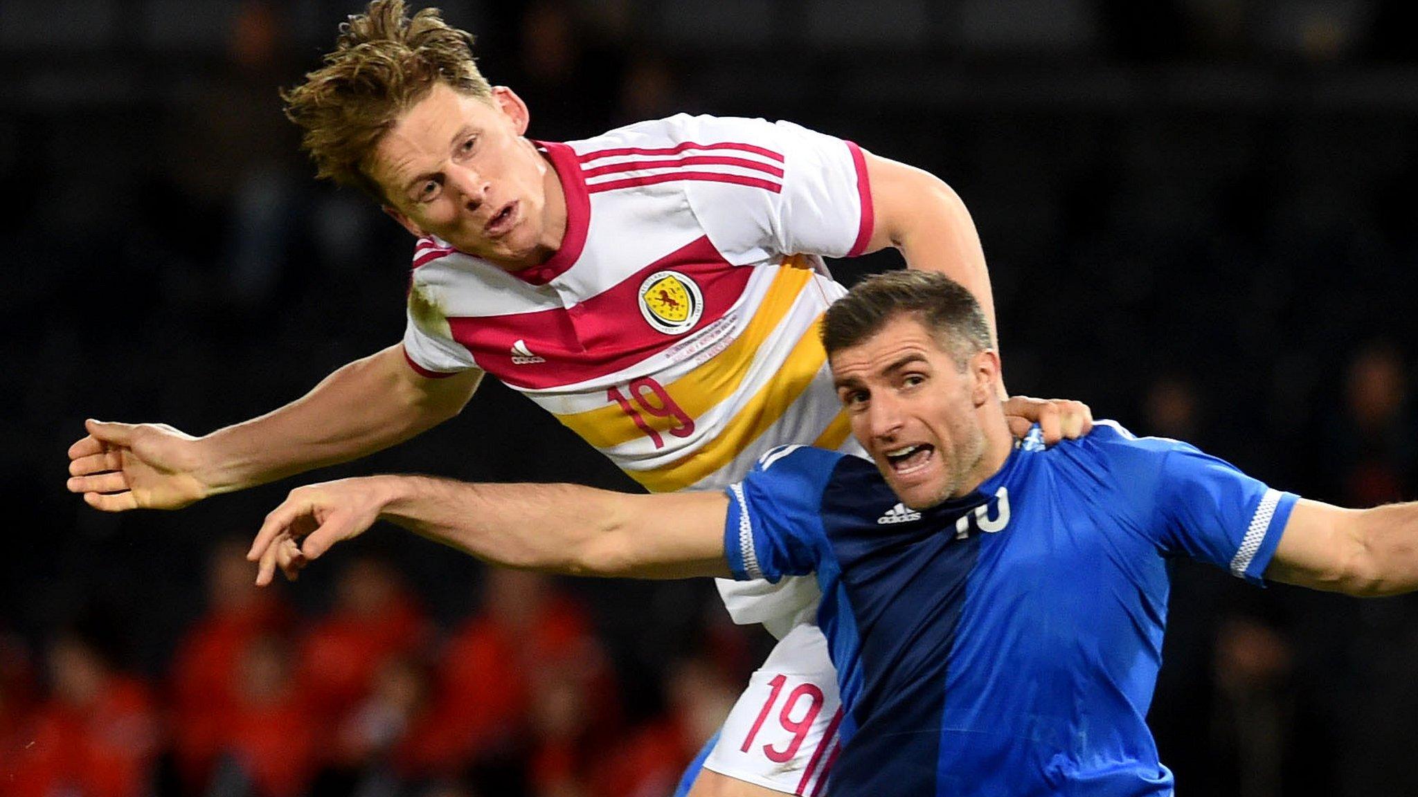 Scotland's Christophe Berra beats Northern Ireland's Aaron Hughes to the ball