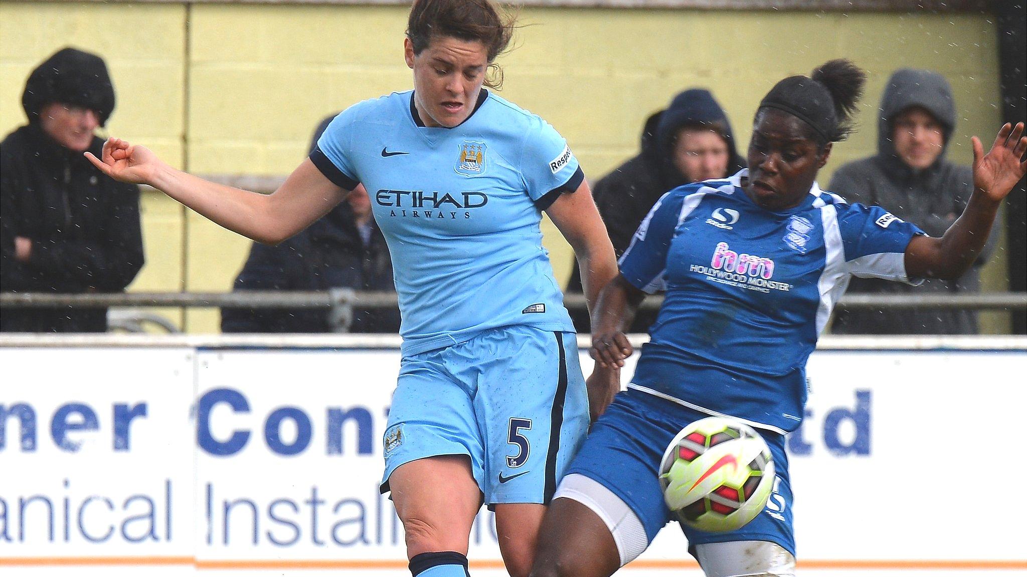 Birmingham's Freda Ayisi (r) is tackled by Jennifer Beattie