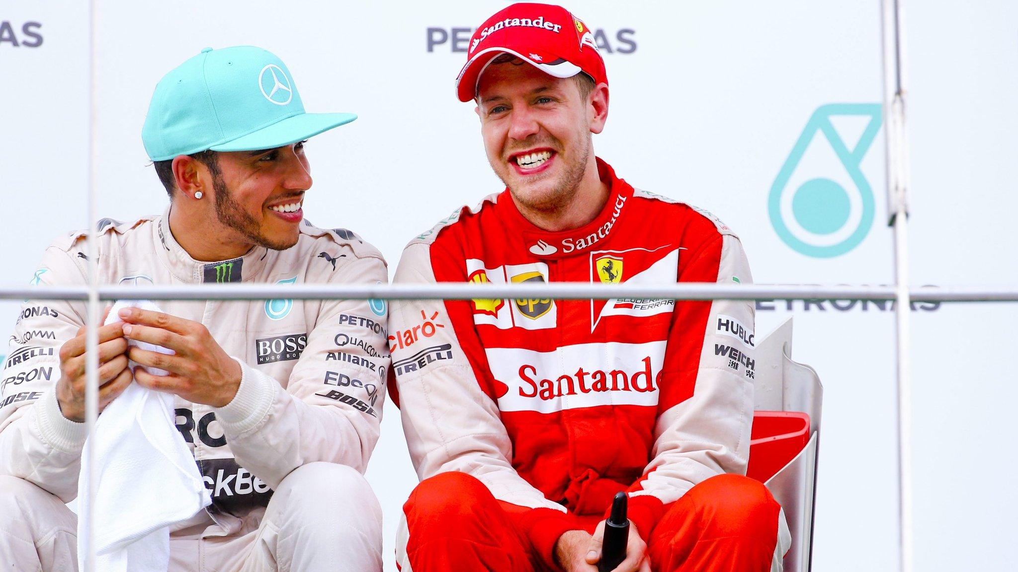 Sebastian Vettel (right) and Lewis Hamilton chat on the podium at the end of the Malaysian Grand Prix