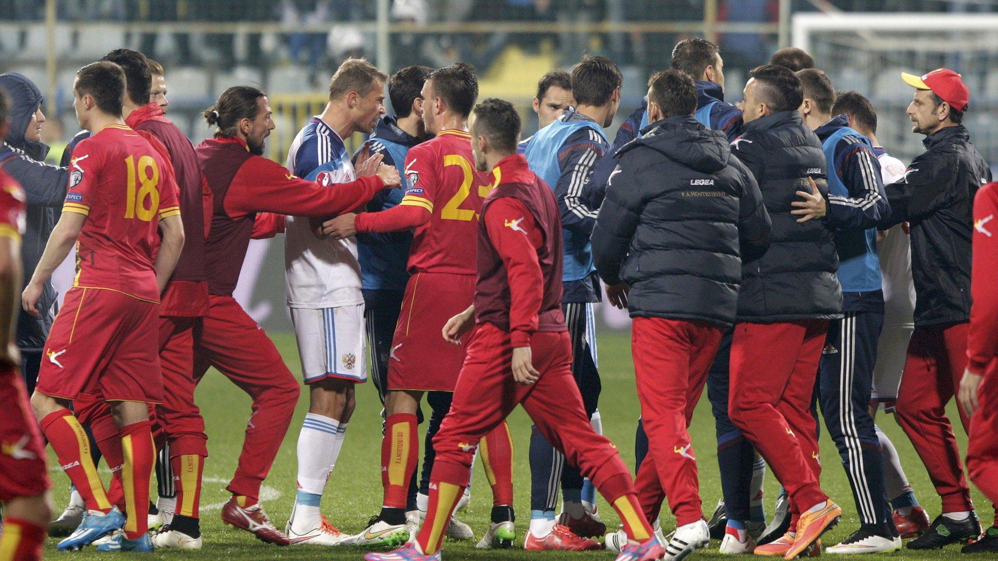 Russia and Montenegro players clash