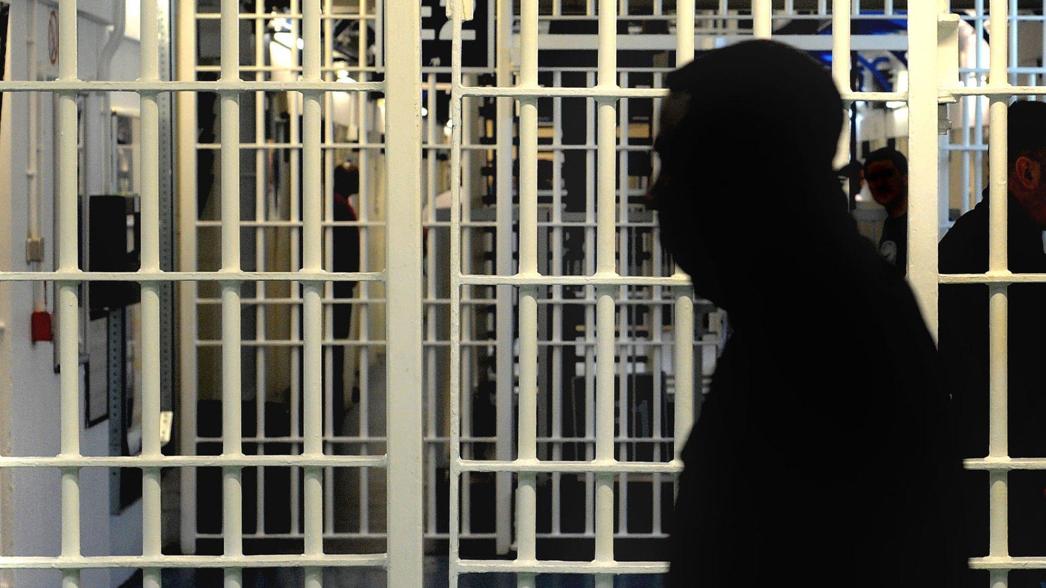 Silhouette of a man in prison