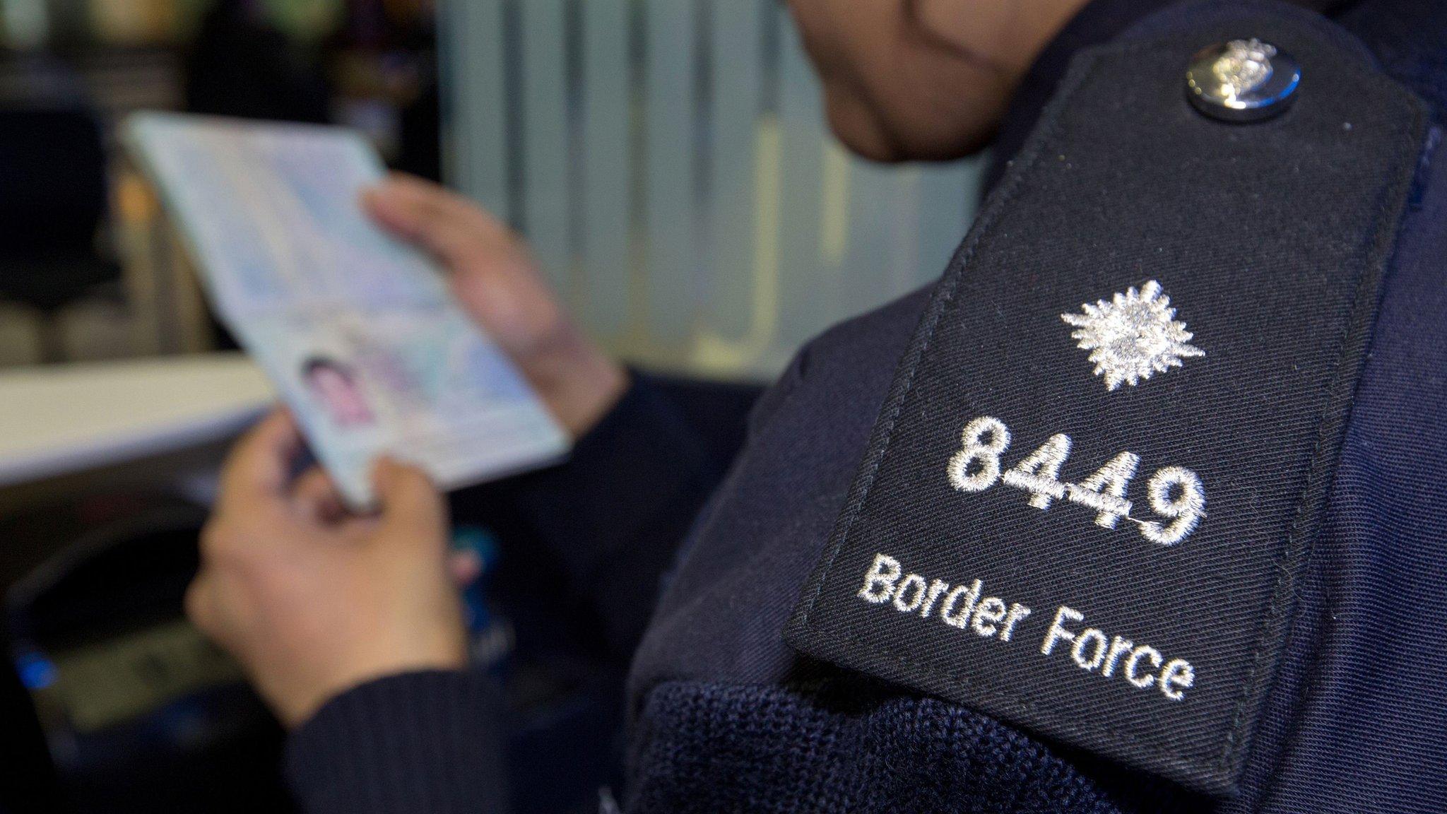 passport being checked by border force official