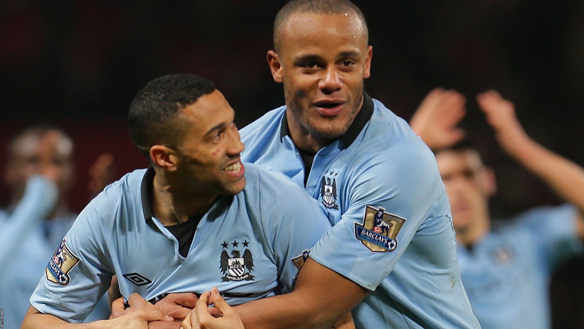 Vincent Kompany and team-mate Gael Clichy