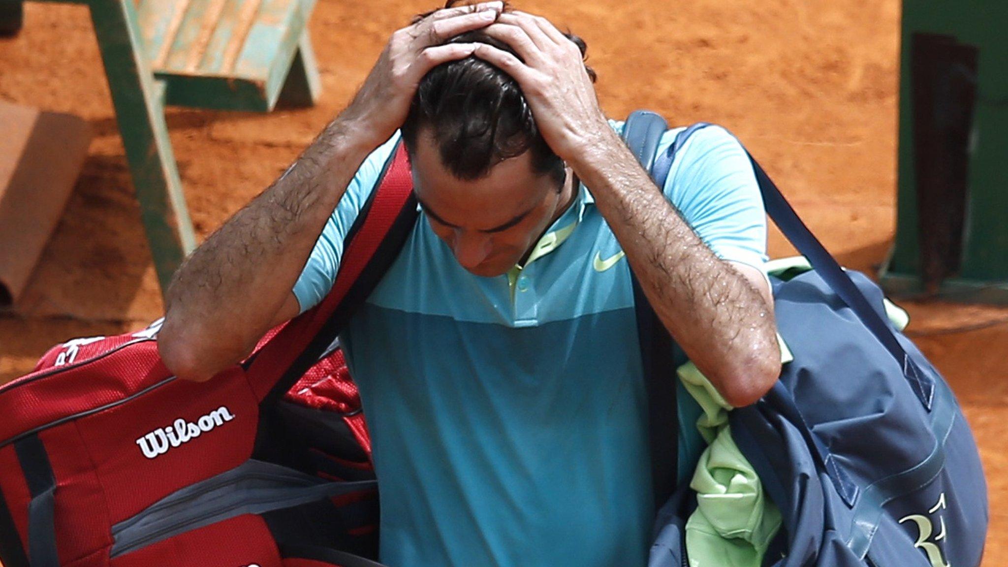 Roger Federer leaves the court after his defeat against Gael Monfils