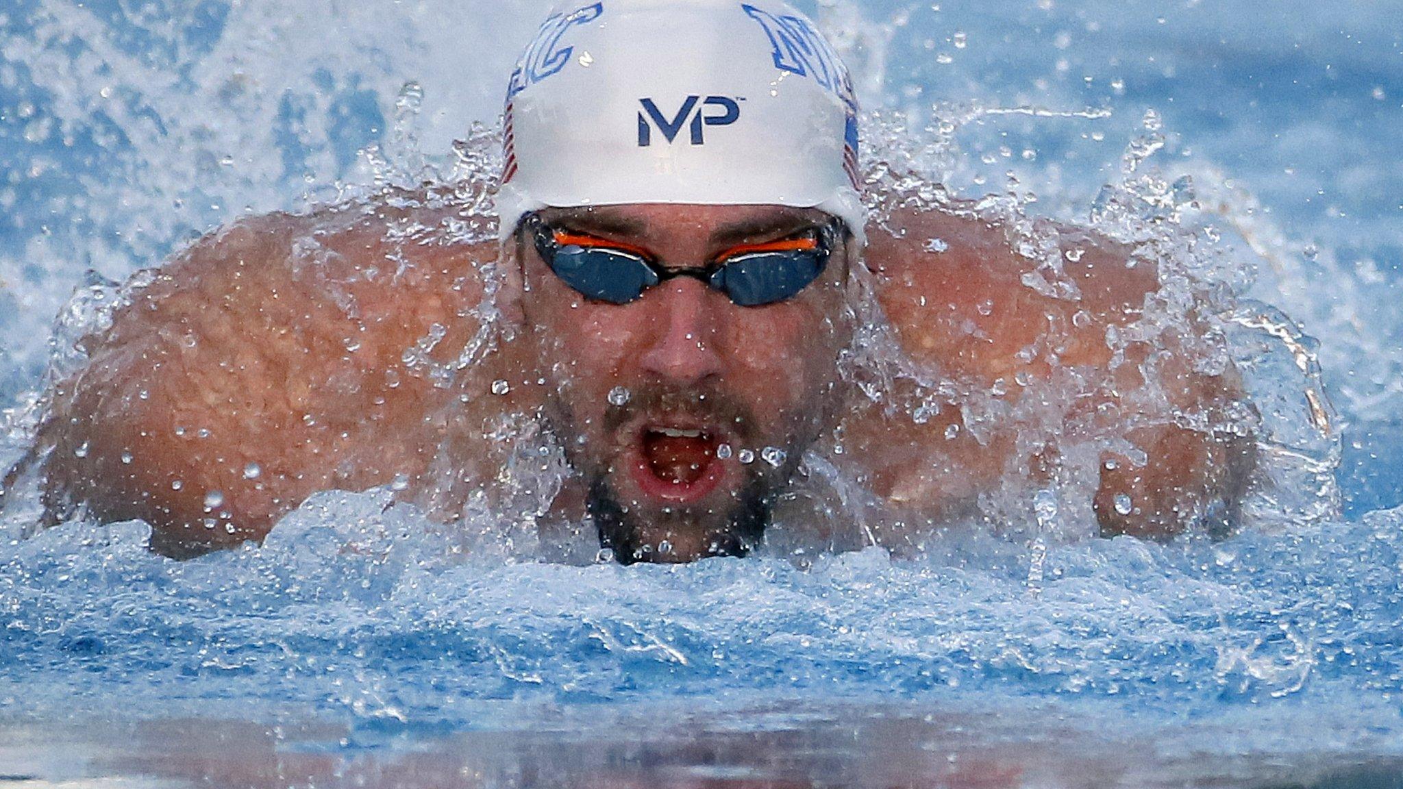 Michael Phelps en route to victory in the 100m butterfly in Phoenix