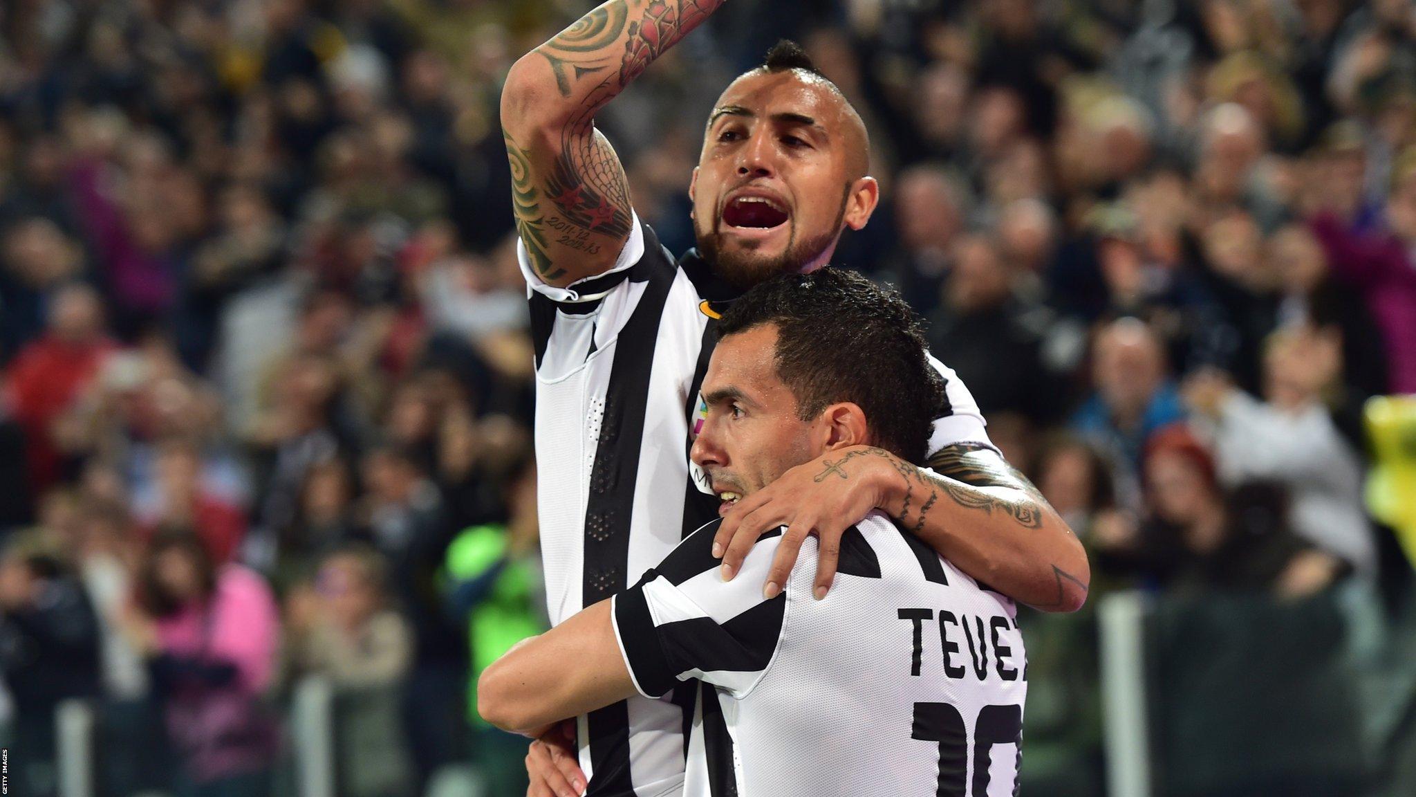 Carlos Tevez (right) celebrates after scoring with Juventus' midfielder from Chile Arturo Vidal