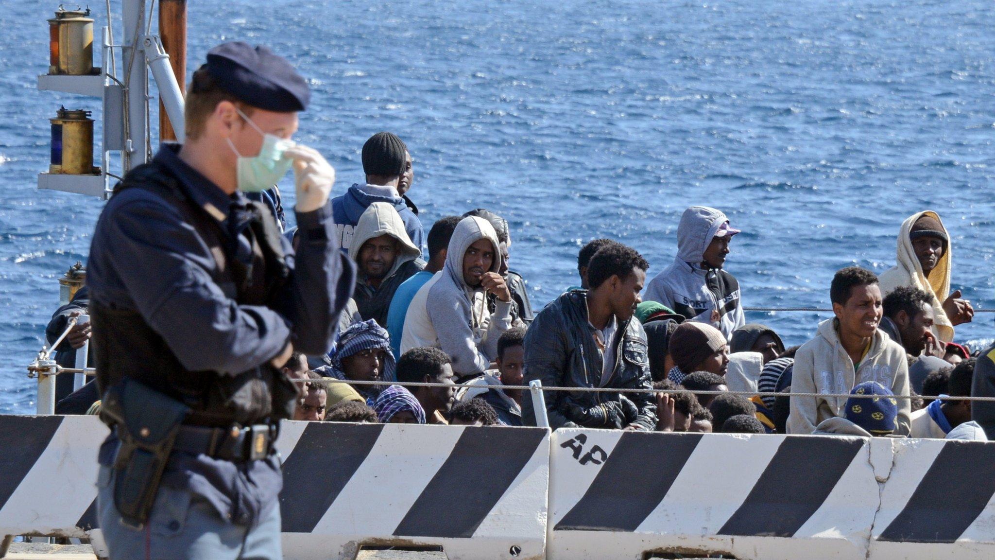 A boat of rescued migrants arrives in Sicily