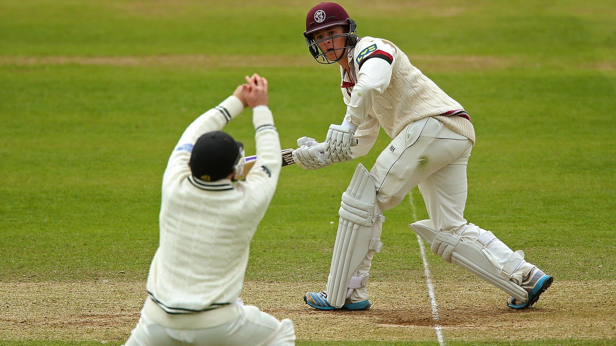 New Zealand's Mark Craig takes a catch from Somerset's Tom Abell