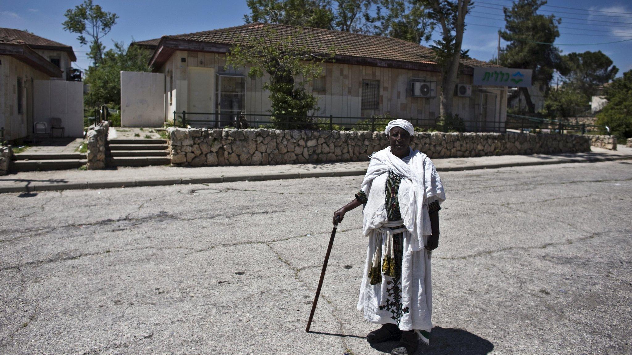 An Israeli of Ethiopian descent stands on the grounds of an absorption centre near Jerusalem