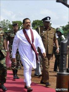 President Mahinda Rajapaksa is escorted by the military to the cabinet meeting