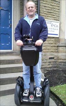 Philip Coates on his Segway scooter