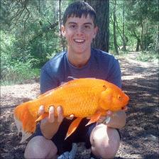 Nick Richards with Billy the giant goldfish