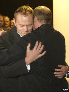 Poland's Prime Minister Donald Tusk and Russian Prime Minister Vladimir Putin hug at the funeral of Polish President Lech Kaczynski who died in a plane crash earlier this year - picture courtesy of Alexey Nikolsky/AFP/Getty Images