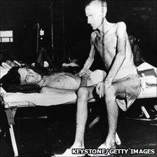 Two emaciated soldiers liberated from a prison camp on Formosa in November 1945