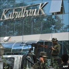 Armed guards outside the main branch of the Kabul Bank