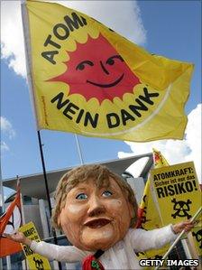 A man wearing an Angela Merkel mask protests against nuclear energy in Berlin (5 September 2010)