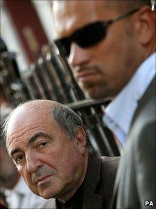 Boris Berezovsky (left) with a bodyguard outside the Russian embassy in London, 31 August