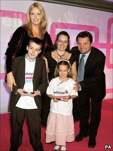 Alexander Ellwood, front left, with model Penny Lancaster, TV presenter Chris Hollins and another winner at the WellChild Awards.