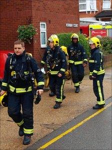 Firemen prepare to enter an apartment in a building in Putney, south-west London, where two women died in a suspected copycat double suicide.