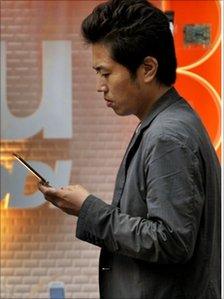 Japanese man using a mobile phone