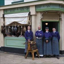 Andrew Sharp, second left, outside his Edwardian era butchery