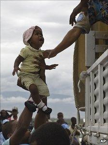 UN helps evacuate a child from Corail-Cesselesse camp 4 Nov 2010