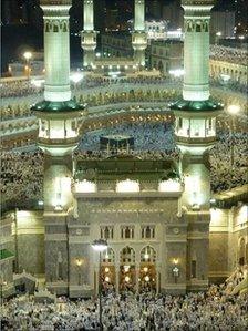 Muslim pilgrims pray around the Grand Mosque in Mecca on November 12, 2010