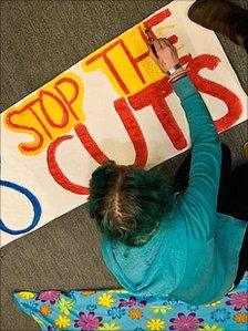 A Plymouth student paints a banner during the occupation