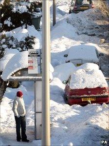 Man waits for bus in Edinburgh