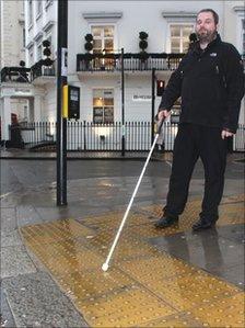 Man walking with white stick