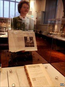 University head of heritage collections Sheila Hingley with a copy of the folio and the original in a case