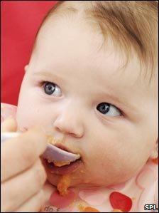 Baby being fed