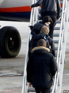 Madina Salamova (second from top) boards a jet from Oslo to Moscow, 24 January