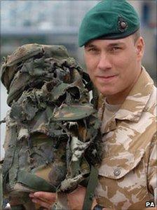 L/Cpl Matthew Croucher with his ripped backpack