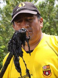 Servio Curipoma shows what is under the soil on the land where he lived