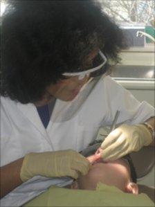 Chandrika at work as a dentist