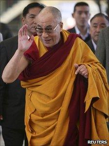 The Dalai Lama heads to a temple in Dharamsala to deliver a lesson on 14 March 2011