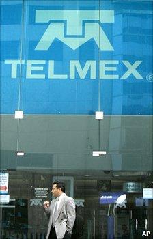 Man stands outside Telmex office - file photo