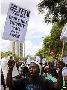 Kenyan protesters hold placards during a demonstration against food and fuel prices rises in Nairobi, Kenya